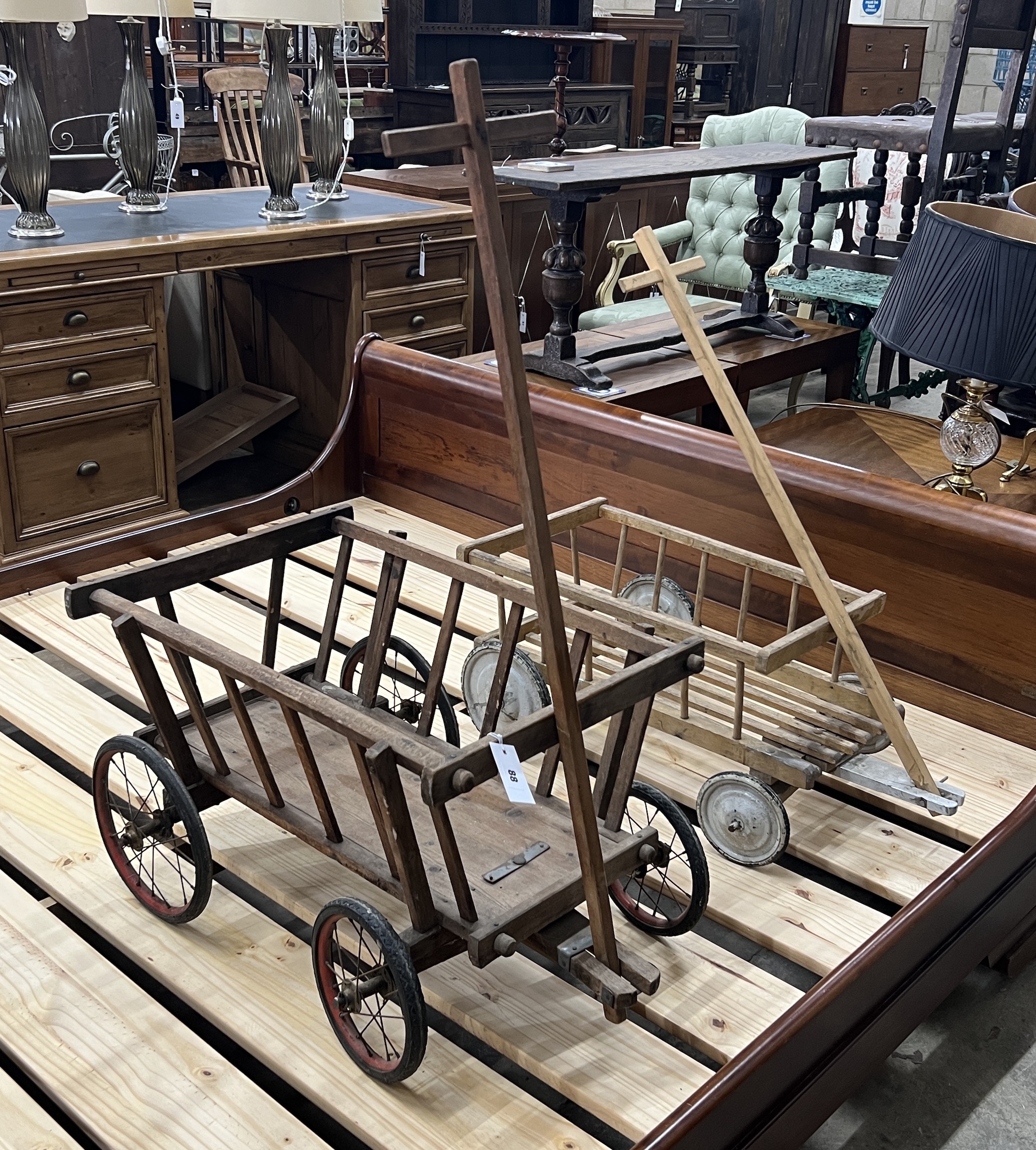 Two vintage pine and beech dog carts, larger length 70cm, width 48cm